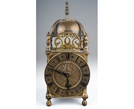 A second half 20th century Smiths brass lantern style clock, Roman numerals, height 24.5cm, comes with a winding key