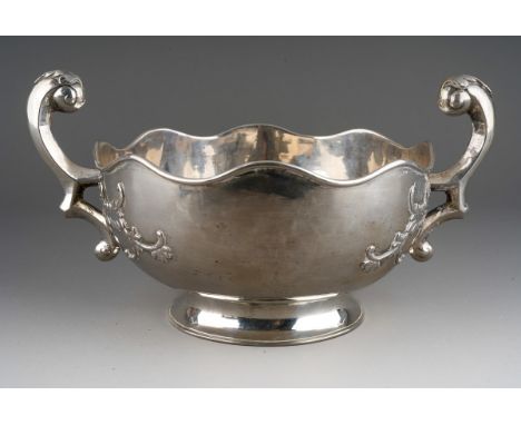 A 19th \ early 20th Century Chinese Export silver two handled bowl, S scroll handles with leaf thumbpiece, the bowl with wavy