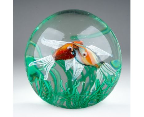 A Murano glass aquarium paperweight, in the manner of Fratelli Toso, internal decoration in the form of two fish amongst reed