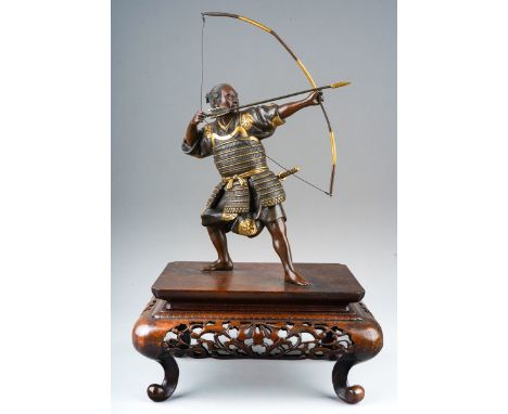 A Japanese Meiji period (1868-1912) parcel gilt bronze figure of a Samurai warrior with bow and arrow, finely cast details, m
