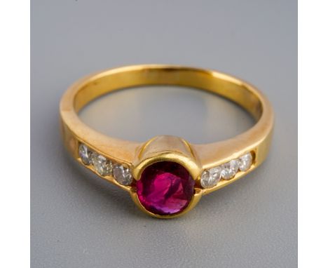 Yellow metal ( tests as 18ct gold)  Ruby and diamond ring, gross weight 4.3g