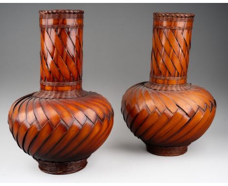 A pair of modern Japanese woven wicker Ikebana style vases with ceramic liners, height 30cm (2)