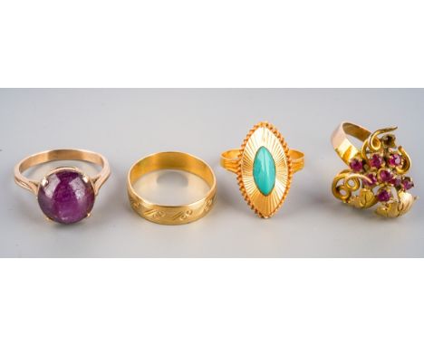 Four yellow metal rings. To include a blue paste marquise shape dress ring, an engraved band ring stamped 750, a ruby foliate