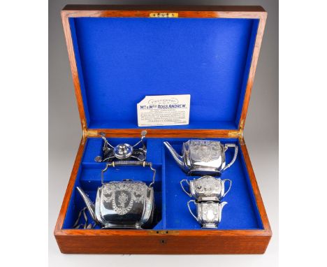 A late Victorian silver matched three piece presentation tea service comprising teapot with ivory isolator, sugar bowl and mi