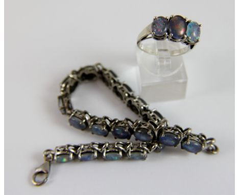 Boulder black opal ring and matching bracelet on silver