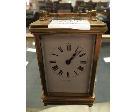 Brass carriage clock made by Russells, Paris?