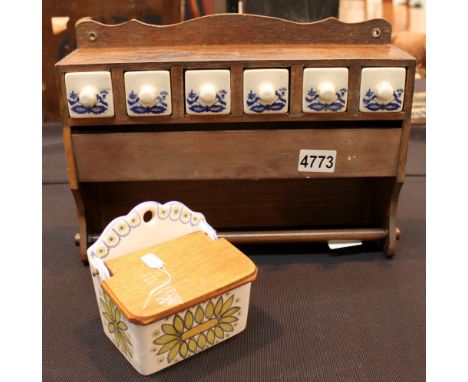 Wooden kitchen rack with ceramic drawers and a ceramic lidded pot