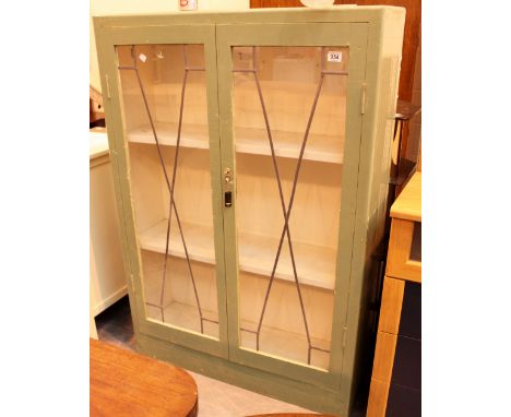 Painted pine three shelf bookcase with glazed twin doors