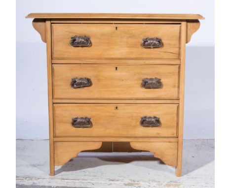 Stripped walnut chest of drawers, rectangular top with a moulded edge, fitted with three long drawers, Art Nouveau pattern ha