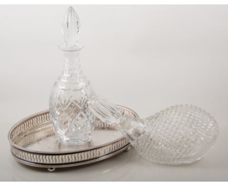 Six cut glass decanters including Caithness crystal decanter formed as golf club, together with two oval silver plated trays,