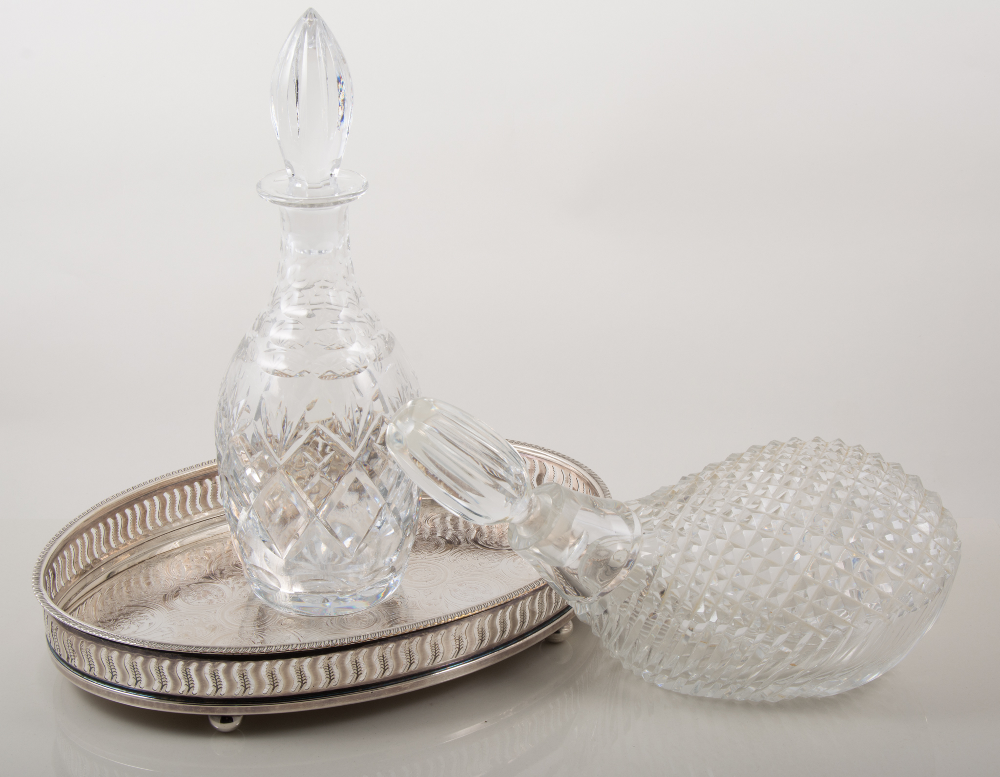 Six cut glass decanters including Caithness crystal decanter formed as