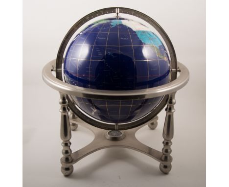 Globe mounted on silvered stand, the globe 12in diameter, overall, height 45cm.