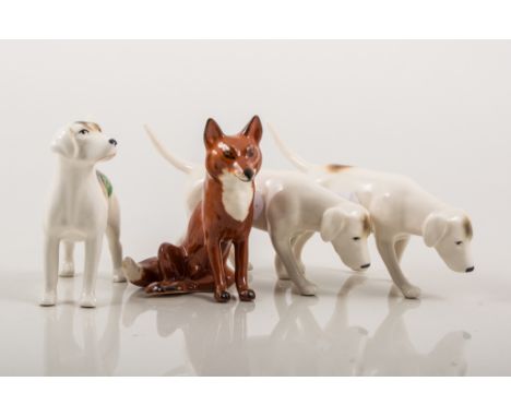 Beswick pottery model of a hound, height 7cm, two other models of a hound and a Beswick model of a seated fox, model 1748 (4)