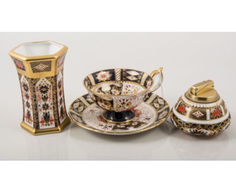 Royal Crown Derby tea cup and saucer, Witches pattern; Royal Crown Derby hexagonal vase, Old Imari pattern, and a similar tab