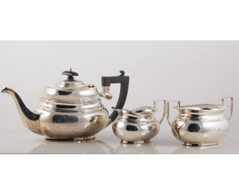 Sliver three piece tea set, by Marson & Jones, Birmingham 1931, oval form, comprising teapot with ebonised handle and finial,