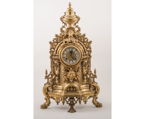 Louis XVI style cast and gilt brass mantel garniture, comprising clock, cased with urn finial, dial with Roman numerals, Fren