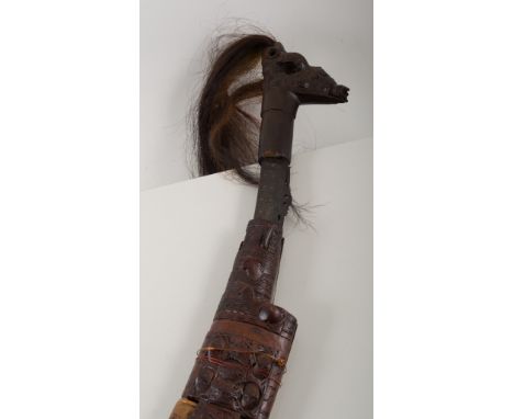 African sword, brass inlaid decorated blade, carved handle, with hair, carved wooden scabbard, overall length 82cm, and a sma