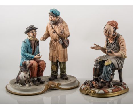 Capodimonte group, 'The Blind Man', and another colourway of the group; together with a Capodimonte figure of a cobbler, (3).