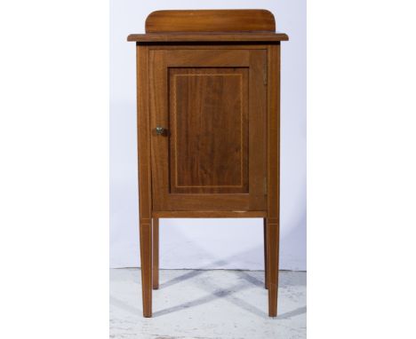 Edwardian mahogany bedside cupboard, rectangular top with a moulded edge, panelled door enclosing a shelf, square tapering le