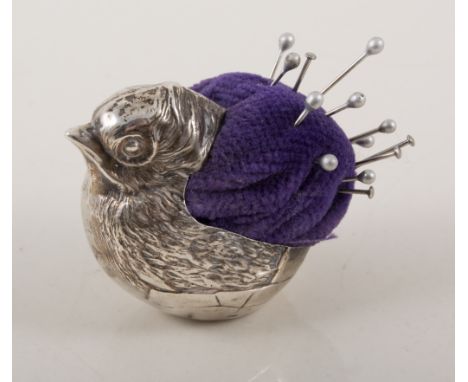 A silver chick pin cushion, Chester, maker and date mark rubbed, 4cm.