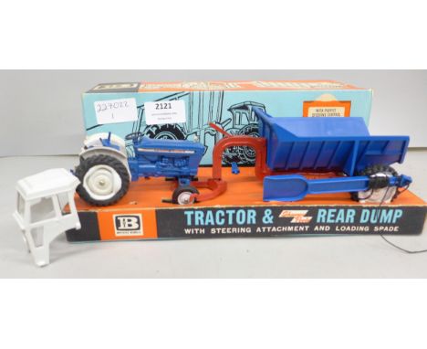 A boxed Britains Model Tractor &amp; Shawnee Poole Rear Dump, number 9630 with steering attachment and loading spade