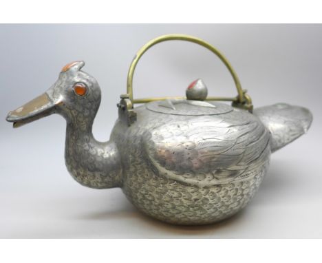 An oriental duck shaped pewter teapot and cover