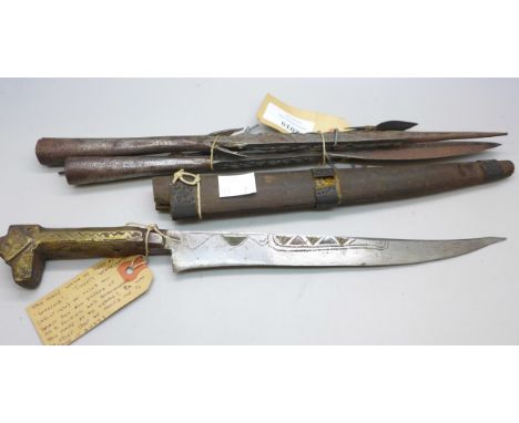 An Islamic dagger and sheath, 34cms l and three African fishing spear tips *THIS LOT IS NOT AVAILABLE FOR PACKING AND POSTING