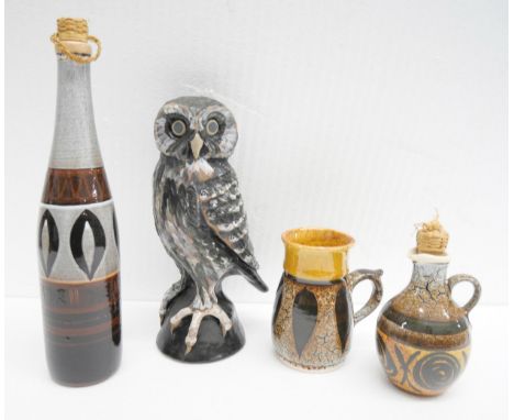 Three pieces of Bass, Exmoor studio pottery, including an owl, 26cms h and two ewers and a another studio pottery decanter&nb