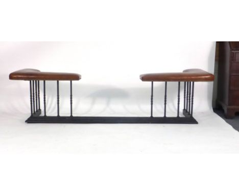 A metalwork club fender with brown leather upholstery, 215 x 57 cm*Please Note: VAT at 20% will be added to the hammer price 