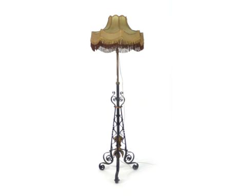 A brass and tole adjustable standard lamp in the manner of W.A.S. Benson   CONDITION REPORT:  May require re-wiring, working 