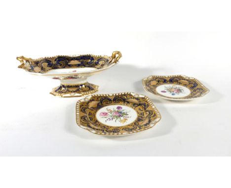 A Spode Felspar two handled tazza typically decorated with a floral spray within a Royal blue and gilt border, w. 34.5 cm, to