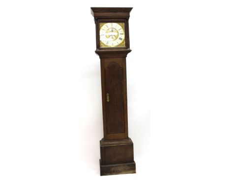 An 18th century longcase clock, the silvered face with brass spandrels and a date aperture by John Wyld of Nottingham, within