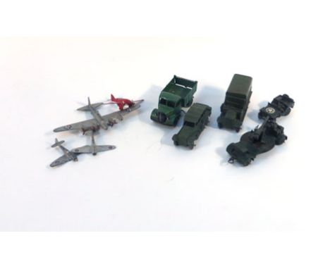 A group of playworn post war Dinky models consisting:25M Bedford End Tipper,60G Light Racer,62G Boeing 'Flying Fortress',70B 