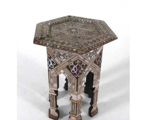 A miniature mother-of-pearl and rosewood hexagonal table of Eastern form, h. 17 cm   CONDITION REPORT:  mother of pearl secti