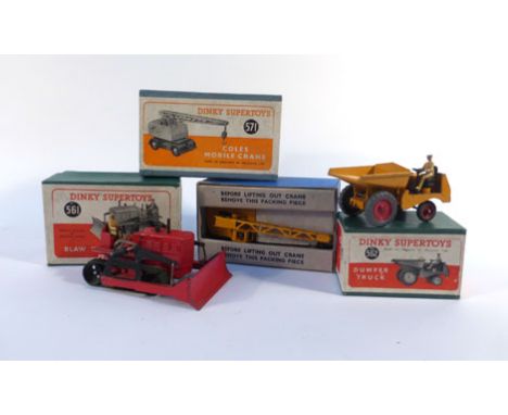 Three Dinky Supertoys models consisting:561 Blaw Know Bulldozer,562 Dumper Truck and 571 Coles Mobile Crane, together with a 