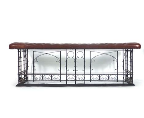 A scrolled metalwork club fender with brown leather button upholstery, 190 x 59 cm*Please Note: VAT at 20% will be added to t