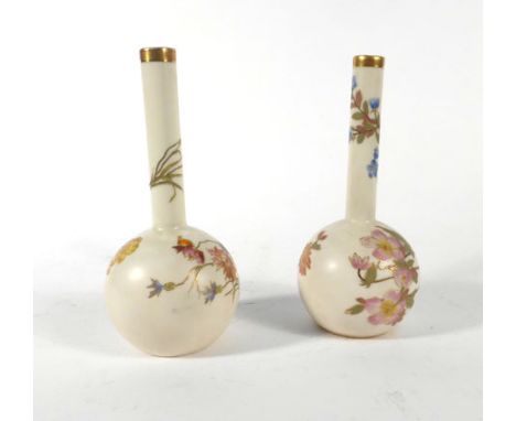 A pair of late 19th century Royal Worcester bottle vases, typically decorated with floral sprays on a blush ivory ground, mod