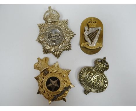Four regimental helmet plates 