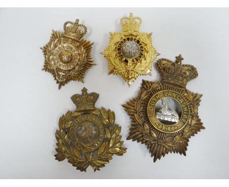 Four regimental helmet plates 