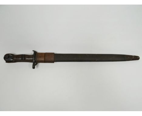 A 1917 US Remington bayonet in scabbard with leather frog together with ivory coloured oriental dagger 