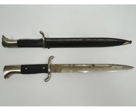 A German dress bayonet by E. Pack & Sohne, Solingen in scabbard marked Berg & Co. together with another similar without scabb