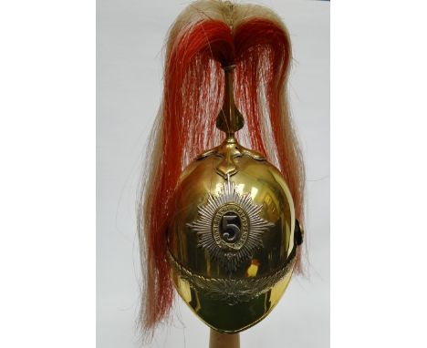 A half-size 5th Dragoon helmet with plumage with wooden stand 