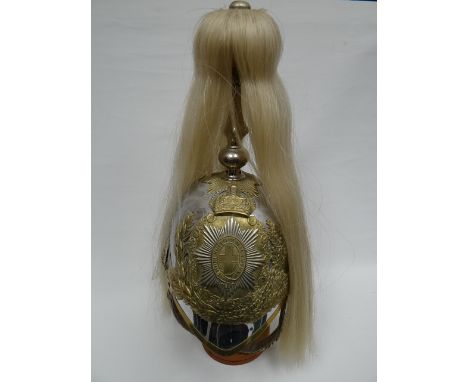 A cavalry parade helmet for other ranks with plate, plumage, chinscale strap and liner 