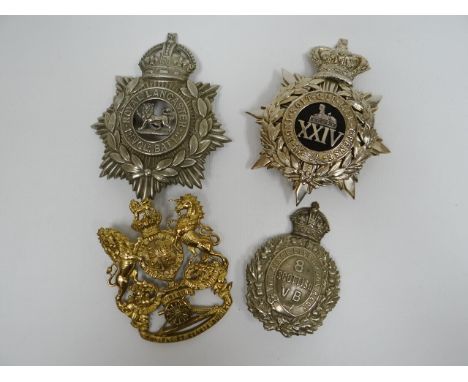 Four regimental helmet plates 