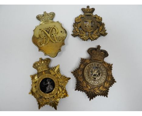 Four regimental helmet plates 