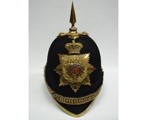 A blue cloth helmet with yellow metal fittings and lining marked 'Humphries & Crook, Haymarket, London SW' 