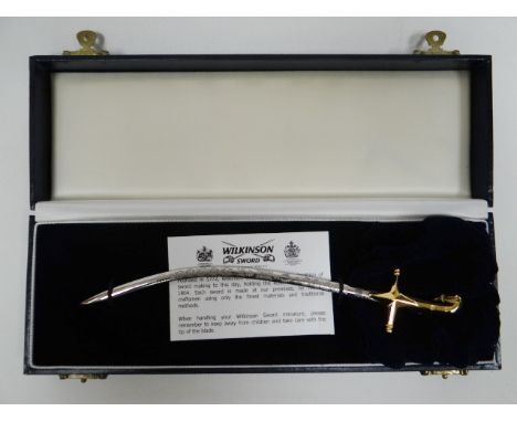 A boxed presentation miniature Wilkinson Sword mameluke letter opener 