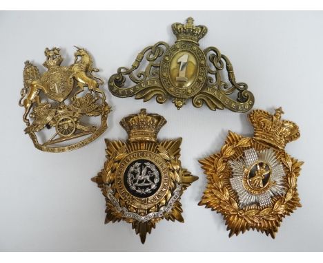 Four regimental helmet plates 