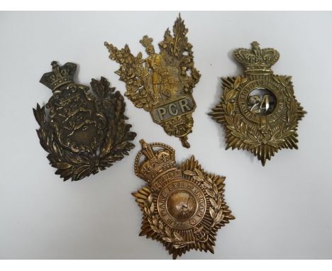 Four regimental helmet plates 
