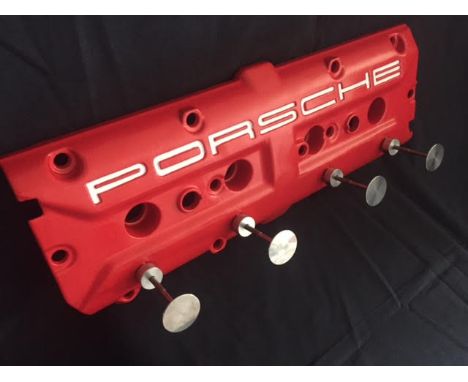 A Porsche 928 cylinder head rocker-cover, powder coated in red and converted into an intriguing wall mounted coat hanger. Spe